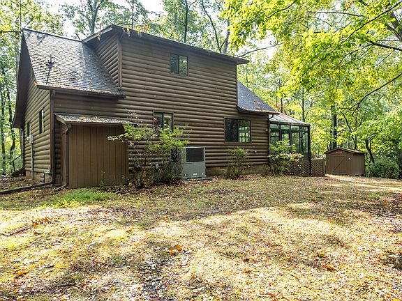 Nestled on over an acre of peaceful woods, this charming 3-bedroom, 2-bathroom log-sided cabin offers the perfect blend of rustic charm and modern comfort. $259,800