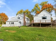 This captivating 4-bedroom, 2.5-bathroom farmhouse, nestled on a serene 4-acre lot, offers a timeless blend of history and modern convenience.