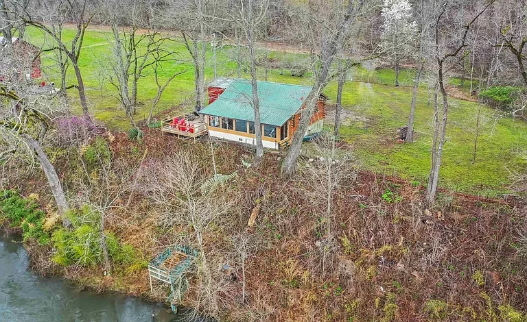 Charming Log Cabin on 3.22 Acres with Grandfathered Dock on the White River – $285,000