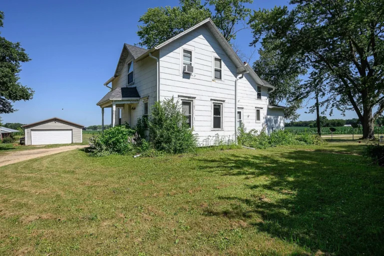 Classic Wisconsin Farmhouse on Over 3 Acres with Large Outbuilding and Endless Possibilities Listed for $300,000