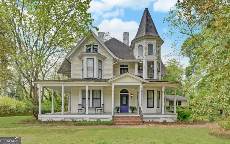 $485K Victorian Time Capsule in Georgia Features 9 Fireplaces, a Turret and Guest Cottage