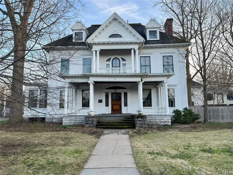 An 1888 Colonial Property in New York Listed for $199,900 With 8 Bedrooms and a Carriage House Apartment